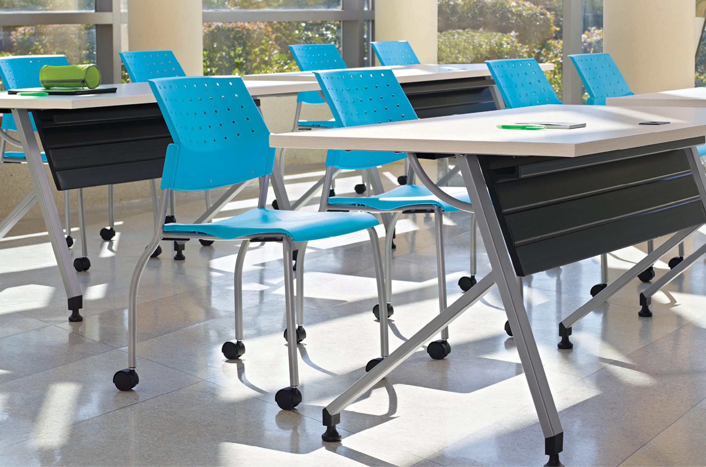 Blue ergonomic executive chair with mesh back & synchronized armrests for comfort